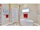 Relaxing bathroom with a free-standing soaking tub at 5221 Wishing Arch Dr, Apollo Beach, FL 33572