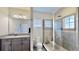 Bathroom with granite countertop, shower, toilet and updated fixtures at 5221 Wishing Arch Dr, Apollo Beach, FL 33572
