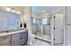 Bathroom with granite countertop, large shower, and updated fixtures at 5221 Wishing Arch Dr, Apollo Beach, FL 33572