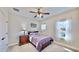 Cozy bedroom with double bed, nightstand, and large window at 5221 Wishing Arch Dr, Apollo Beach, FL 33572