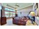 Spacious bedroom with water views, plush bedding and large windows at 5221 Wishing Arch Dr, Apollo Beach, FL 33572