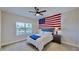 Bright bedroom with water views, carpeted floor, and a full-size bed at 5221 Wishing Arch Dr, Apollo Beach, FL 33572