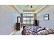Spacious bedroom with water views, plush bedding and large windows at 5221 Wishing Arch Dr, Apollo Beach, FL 33572