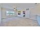 Spacious bonus room with carpeted floor, large window, and access to a bedroom at 5221 Wishing Arch Dr, Apollo Beach, FL 33572