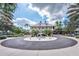 Community clubhouse with fountain and circular drive at 5221 Wishing Arch Dr, Apollo Beach, FL 33572