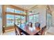 Bright dining room with water views and elegant wooden table at 5221 Wishing Arch Dr, Apollo Beach, FL 33572