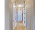 Bright hallway with light walls and hardwood flooring at 5221 Wishing Arch Dr, Apollo Beach, FL 33572