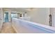 Upstairs hallway with carpet and access to bedrooms at 5221 Wishing Arch Dr, Apollo Beach, FL 33572