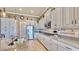 Modern kitchen with granite countertops and stainless steel appliances at 5221 Wishing Arch Dr, Apollo Beach, FL 33572