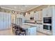Modern kitchen featuring granite countertops and stainless steel appliances at 5221 Wishing Arch Dr, Apollo Beach, FL 33572