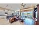 Open kitchen with white cabinets and an island at 5221 Wishing Arch Dr, Apollo Beach, FL 33572