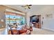 Living room with sliding doors leading to a patio overlooking the water at 5221 Wishing Arch Dr, Apollo Beach, FL 33572