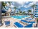 Resort-style pool with a water slide and lounge chairs at 5221 Wishing Arch Dr, Apollo Beach, FL 33572