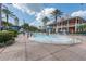 Community pool with a fountain and ample seating at 5221 Wishing Arch Dr, Apollo Beach, FL 33572