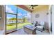Spacious screened porch with wicker furniture and stunning water views at 5221 Wishing Arch Dr, Apollo Beach, FL 33572