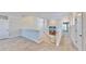 Upstairs hallway with carpet, leading to bedrooms and additional rooms at 5221 Wishing Arch Dr, Apollo Beach, FL 33572