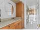 Bathroom with light wood cabinets and a large vanity at 6250 7Th W Ave # 6250, Bradenton, FL 34209