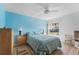 Bedroom with light blue walls, a double bed, and wood flooring at 6250 7Th W Ave # 6250, Bradenton, FL 34209