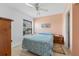 Bedroom with peach walls, a double bed, and wood flooring at 6250 7Th W Ave # 6250, Bradenton, FL 34209