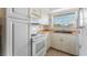 White kitchen with wood countertops and appliances at 6250 7Th W Ave # 6250, Bradenton, FL 34209