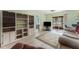 Living room with light flooring, built-in shelves, and sliding doors at 6250 7Th W Ave # 6250, Bradenton, FL 34209