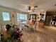 Dining room with adjacent kitchen and view to the front yard at 700 16Th Nw St, Largo, FL 33770