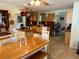 Open kitchen with light wood cabinets and an island at 700 16Th Nw St, Largo, FL 33770