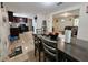 Open dining room with table, chairs, and view of the kitchen and living area at 7211 Waycross Ave, Tampa, FL 33619