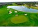 Golf course with pond and manicured greens at 8015 Willow Brook Dr, Spring Hill, FL 34606