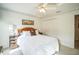 Well-lit bedroom with ceiling fan and ample closet space at 8015 Willow Brook Dr, Spring Hill, FL 34606