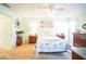 Spacious bedroom with carpeted floor, ceiling fan, and ample natural light at 8015 Willow Brook Dr, Spring Hill, FL 34606