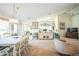 Open concept dining room with view into kitchen and living room at 8015 Willow Brook Dr, Spring Hill, FL 34606