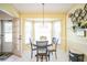Eat-in kitchen with white cabinets, bay window, and breakfast nook at 8015 Willow Brook Dr, Spring Hill, FL 34606