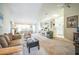 Open concept living and dining area with neutral decor and lots of light at 8015 Willow Brook Dr, Spring Hill, FL 34606