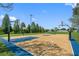 Outdoor community basketball court with blue and tan markings at 832 Christina Cir, Oldsmar, FL 34677