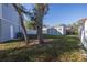 View of the backyard shed and the house's side at 9446 Laura Anne Dr, Seminole, FL 33776