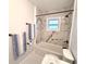 Renovated bathroom, featuring a marble shower and new vanity at 9801 53Rd N Ln, Pinellas Park, FL 33782