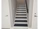 Modern staircase with black and white steps and a black railing at 122 W Sligh Ave, Tampa, FL 33604