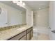 Bathroom boasts granite countertop and a shower/tub combo at 12231 Streambed Dr, Riverview, FL 33579