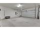 Attached garage with ample storage shelving at 12231 Streambed Dr, Riverview, FL 33579