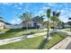 Two-story house with palm trees and a landscaped yard at 12231 Streambed Dr, Riverview, FL 33579