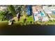 Aerial view of property, highlighting private dock and lake access at 12417 84Th Way, Largo, FL 33773