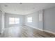 Spacious bedroom with hardwood floors and two windows at 12417 84Th Way, Largo, FL 33773