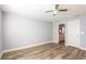 Main bedroom with ceiling fan and ensuite bathroom at 12417 84Th Way, Largo, FL 33773