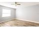 Bedroom with ceiling fan and hardwood floors at 12417 84Th Way, Largo, FL 33773