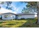 Single story home with front yard and mature trees at 12417 84Th Way, Largo, FL 33773