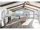 Modern kitchen features stainless steel appliances, island, and vaulted ceiling at 12417 84Th Way, Largo, FL 33773