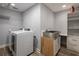 Clean laundry room with new washer, dryer, and storage at 12417 84Th Way, Largo, FL 33773