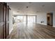 Open living space with wood-look tile floors and barn door at 12417 84Th Way, Largo, FL 33773