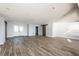 Bright living room featuring hardwood floors and barn doors at 12417 84Th Way, Largo, FL 33773